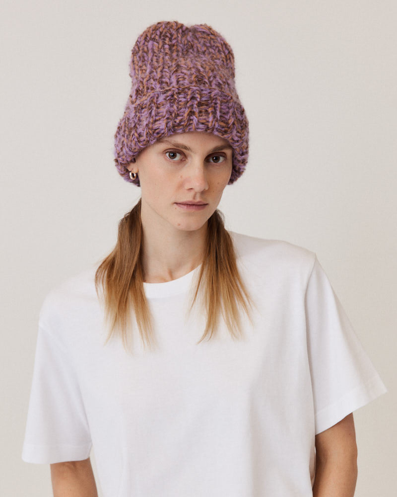 Model wearing hand-knitted beanie