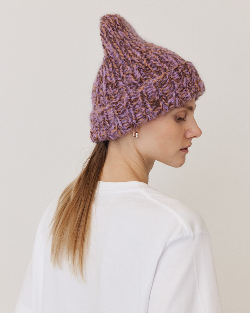 Model wearing hand-knitted beanie