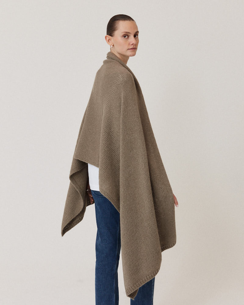 Model wearing olive stole knitted from alpaca wool