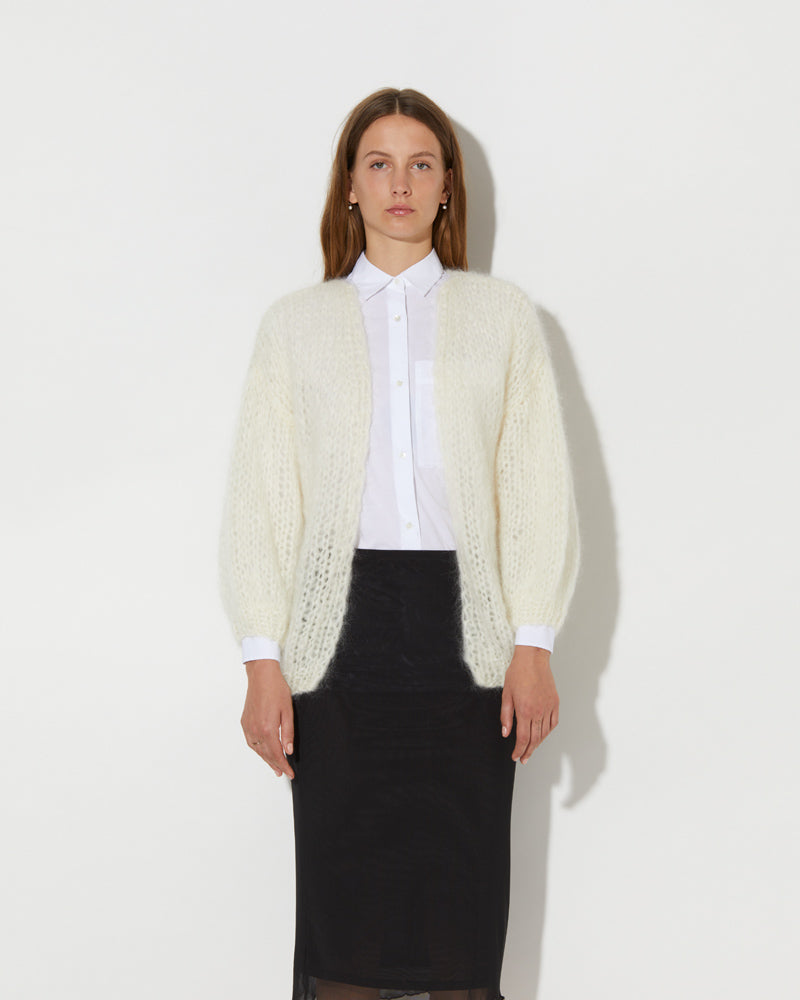 Model is wearing MAIAMI oversized cardigan.