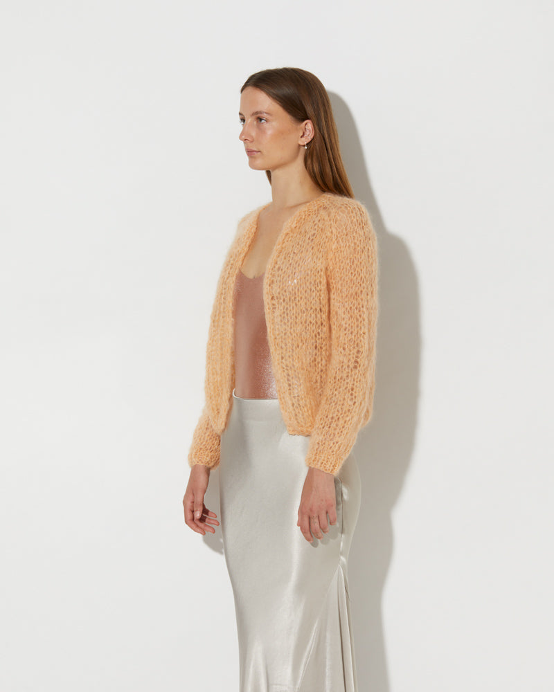 Side view of Model wearing the Mohair Small Cardigan Light. Trendy mohair cardigan for women.