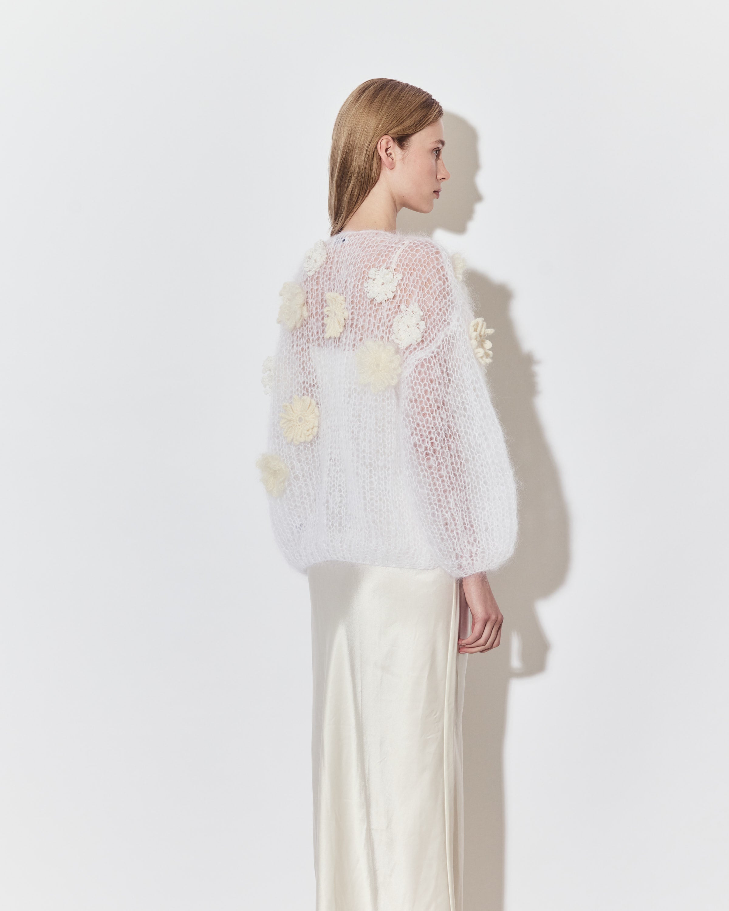 Maiami bridal knitwear layered over a minimalist wedding dress