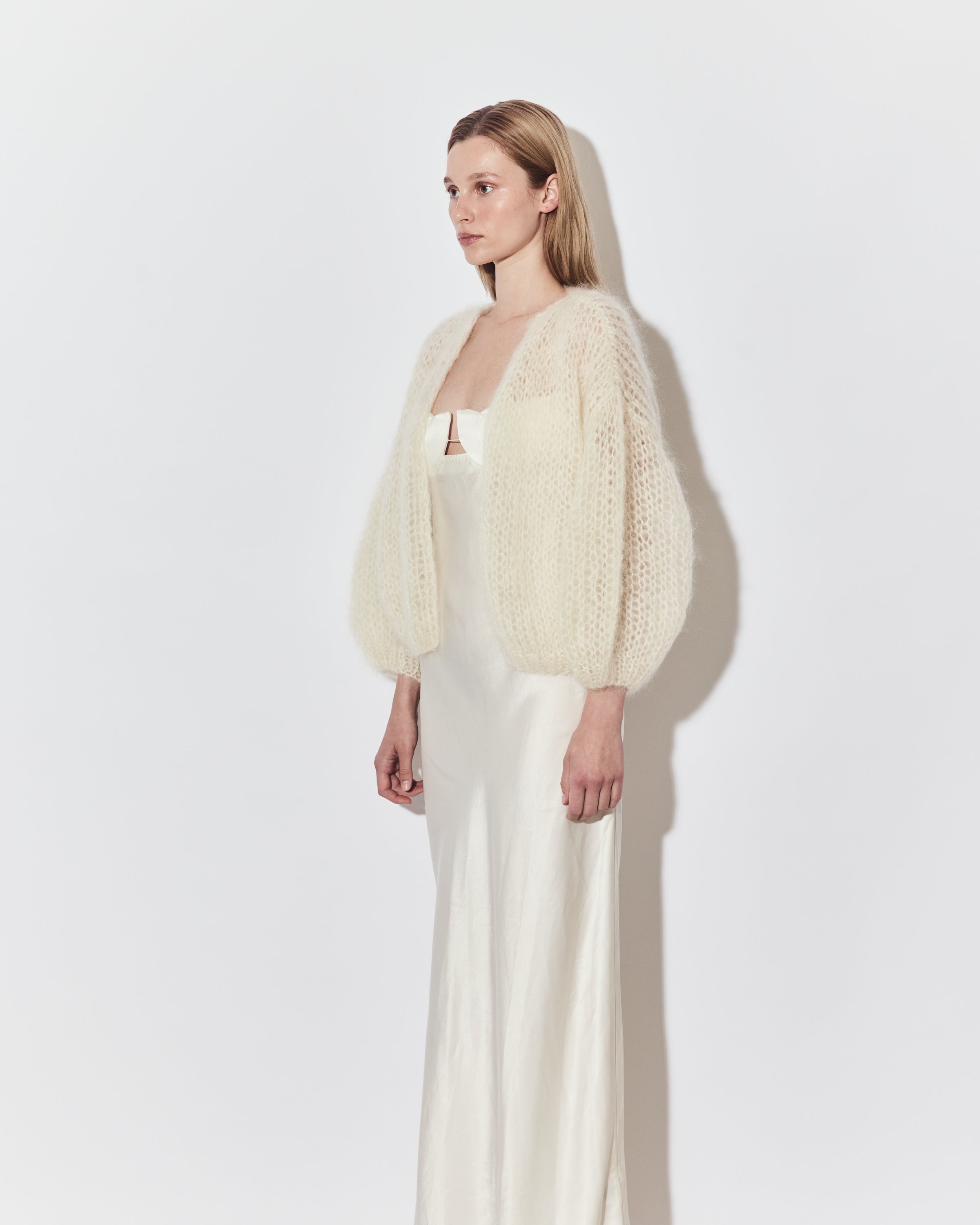 Maiami bridal knitwear layered over a minimalist wedding dress