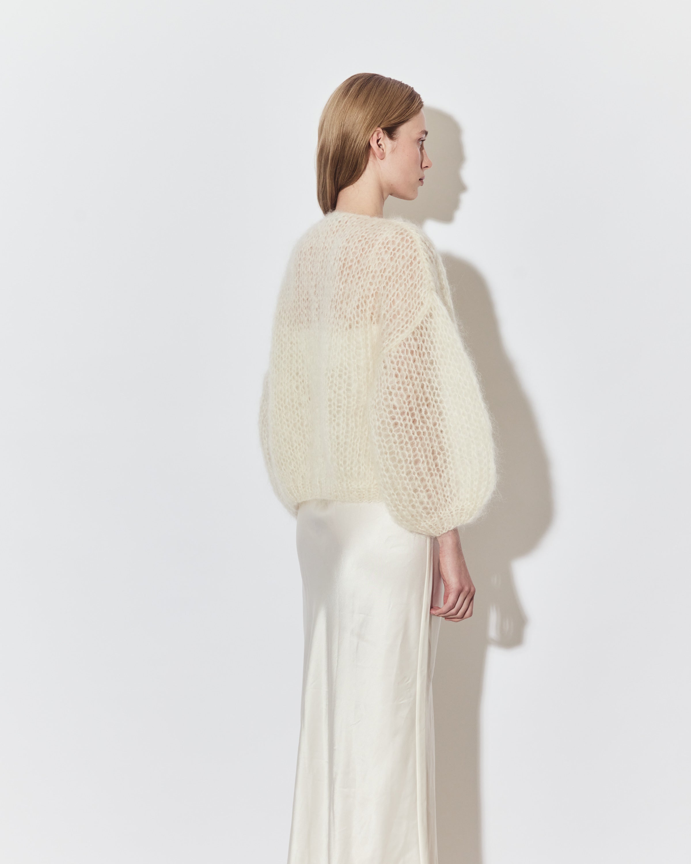 Maiami bridal knitwear layered over a minimalist wedding dress