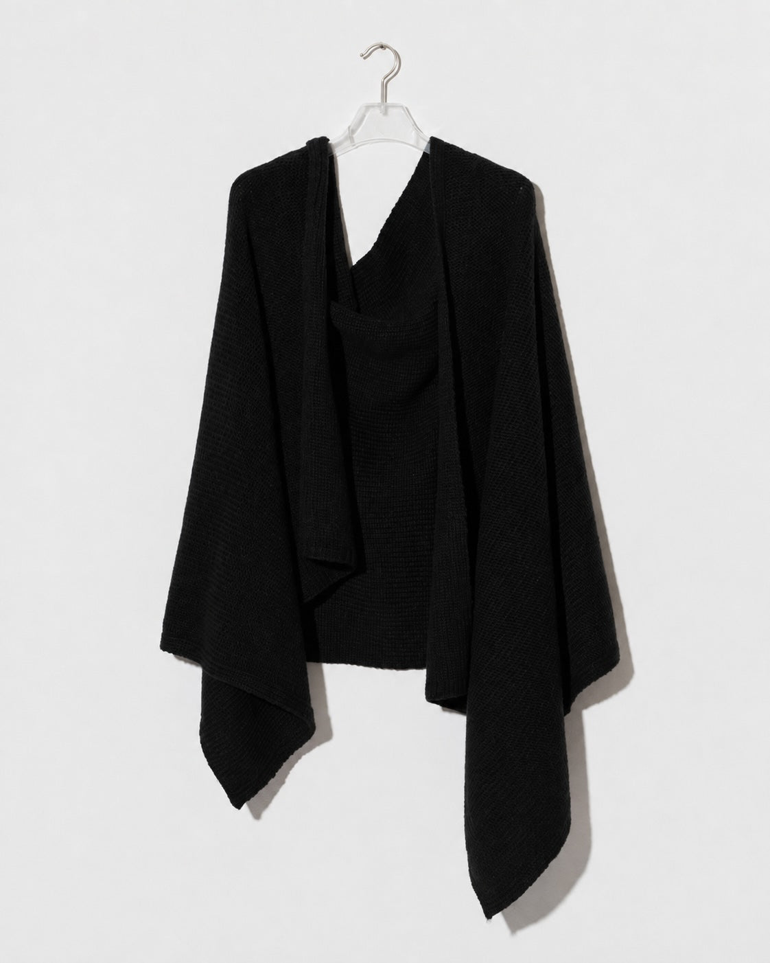 Black stole knitted from alpaca wool