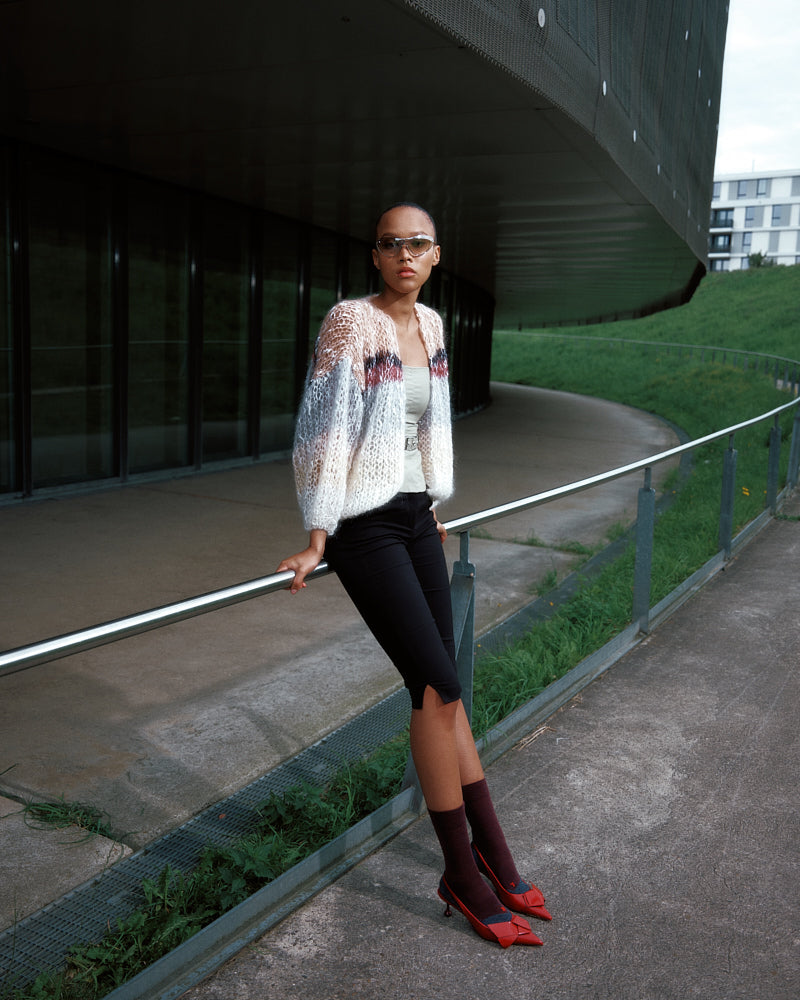 Model wearing striped bouclé bomber jacket with textured knit, by Maiami, Spring 2025