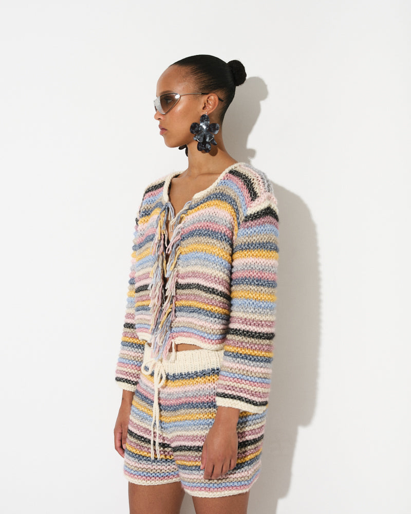 Model wearing cotton merino striped knit jacket by Maiami, Spring 2025