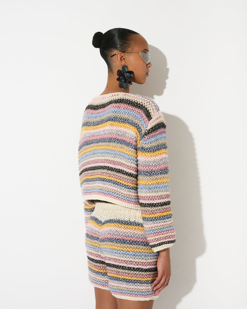 Model wearing cotton merino striped knit jacket by Maiami, Spring 2025