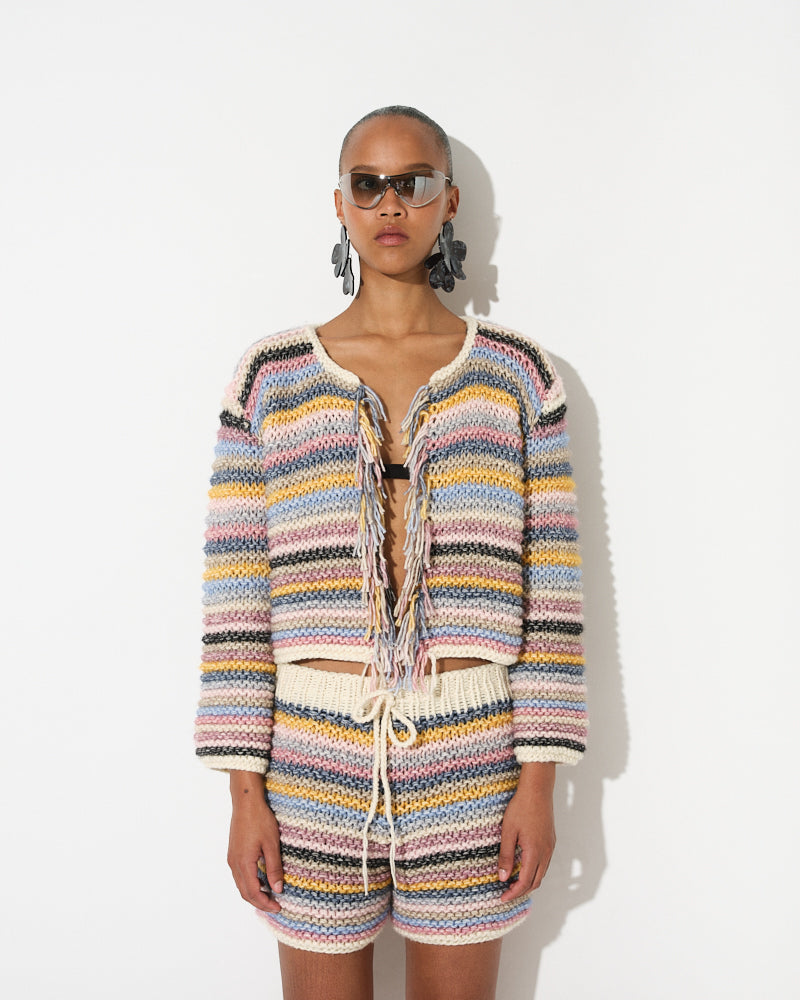 Model wearing cotton merino striped knit jacket by Maiami, Spring 2025