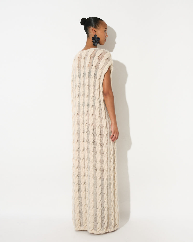 Model wearing lightweight cable knit cotton mohair dress by Maiami, Spring 2025