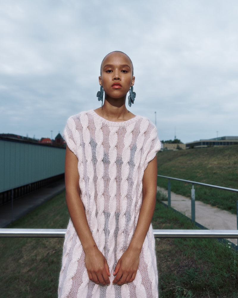 Model wearing lightweight cable knit cotton mohair dress by Maiami, Spring 2025