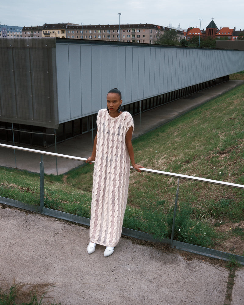 Model wearing lightweight cable knit cotton mohair dress by Maiami, Spring 2025