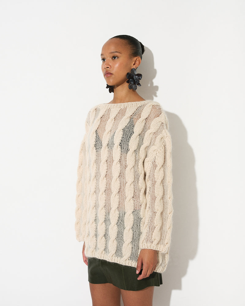 Model wearing cotton mohair cable pullover with transparent finish by Maiami, Spring 2025