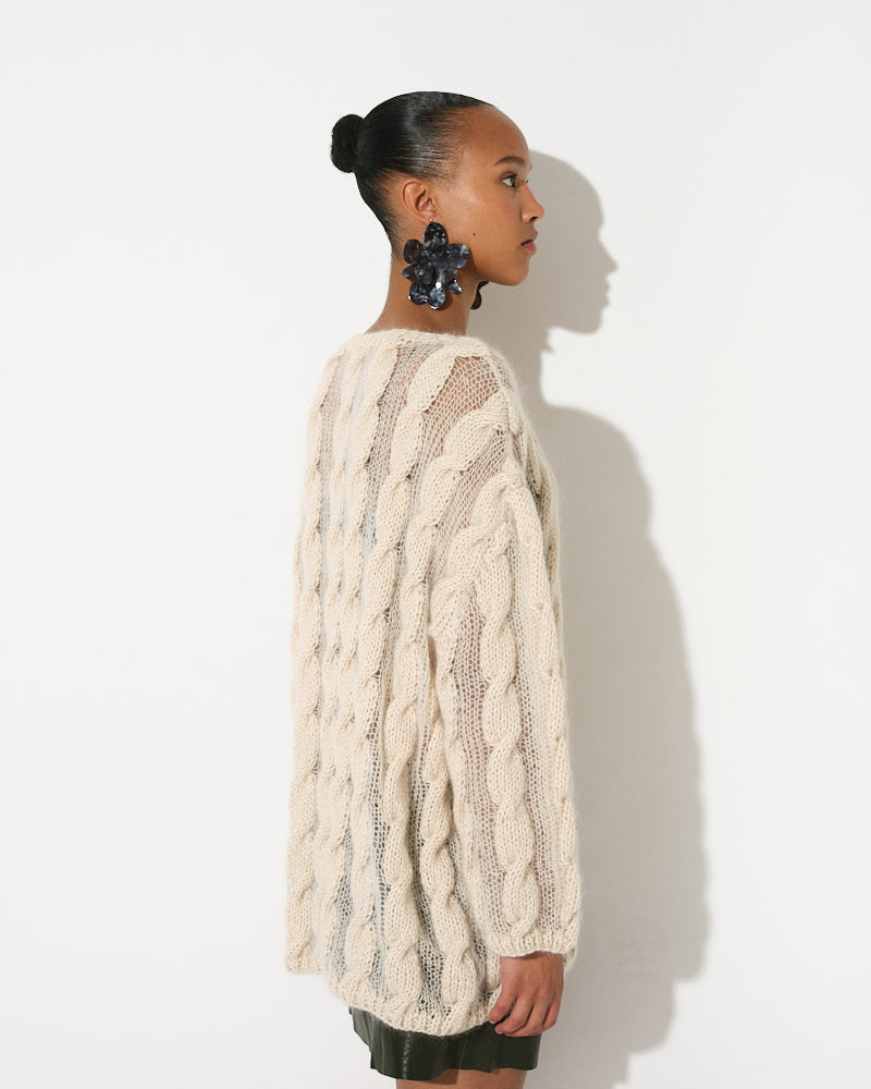 Model wearing cotton mohair cable pullover with transparent finish by Maiami, Spring 2025