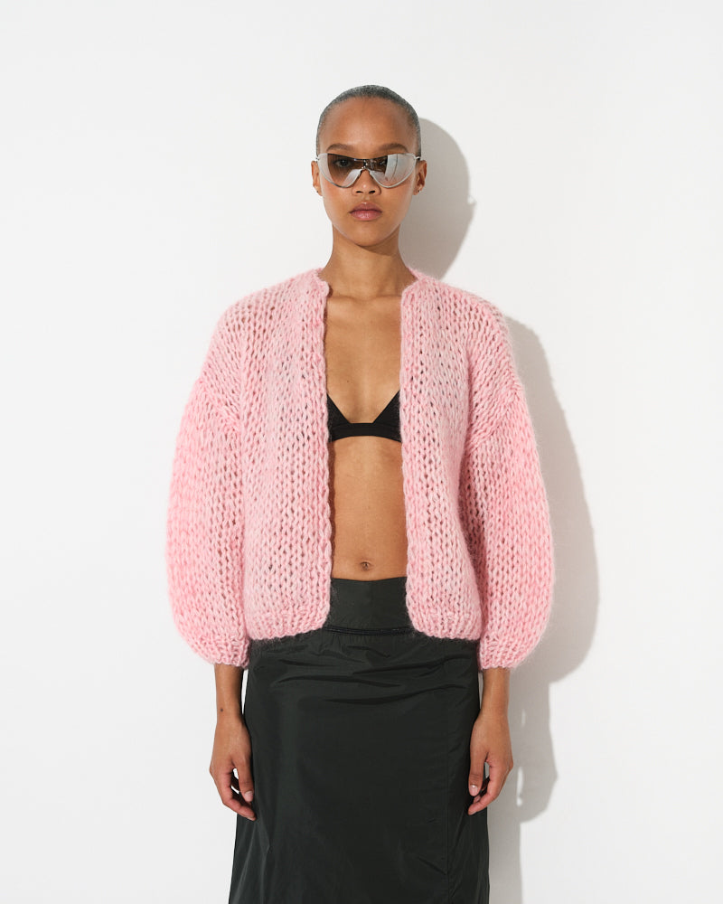 Model wearing lightweight mohair bomber cardigan, short and voluminous by Maiami, Spring 2025