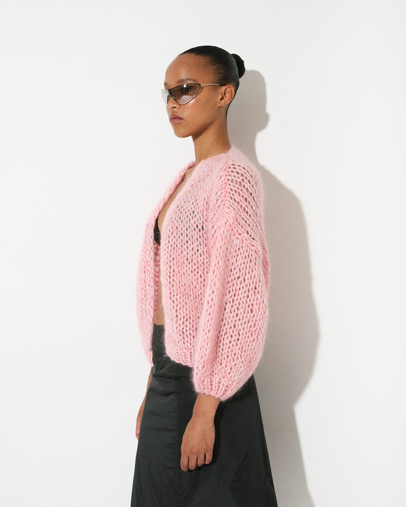 Model wearing lightweight mohair bomber cardigan, short and voluminous by Maiami, Spring 2025