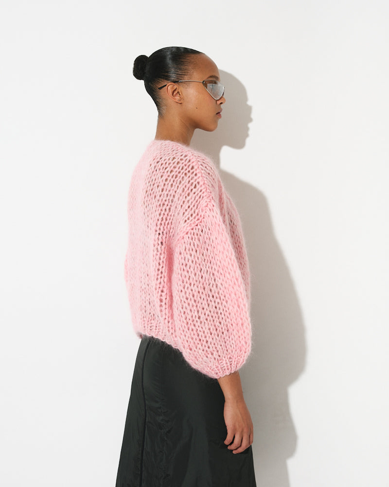 Model wearing lightweight mohair bomber cardigan, short and voluminous by Maiami, Spring 2025