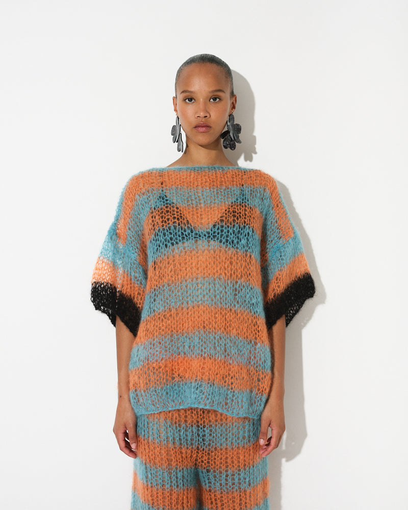 Model wearing long striped mohair t-shirt inspired by basketball jerseys, Spring 2025