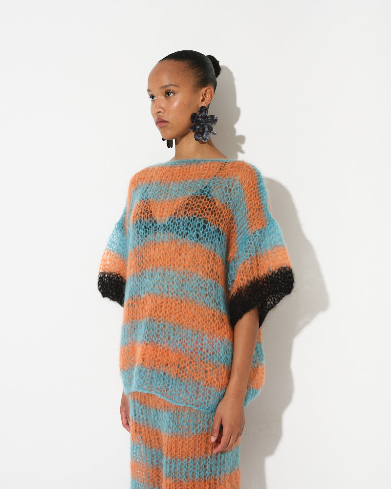 Model wearing long striped mohair t-shirt inspired by basketball jerseys, Spring 2025