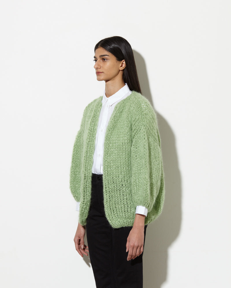 Maiami big Cardigan from side view. Made from Mohair in pistachio.