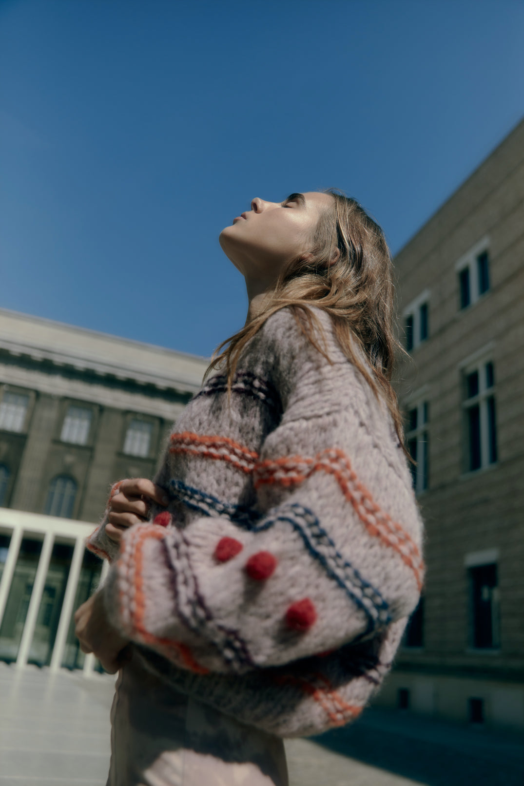 Model wearing Alpaca big bomber in Bobbles. 