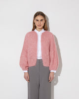 Frontal view of model wearing the new in Alpaca Big Bomber in the color 'Strawberry Cream 1832'