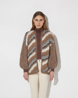 Frontal view of model wearing the new in Alpaca Big Cardigan with diagonal stripes in the color 'Camel Grey'