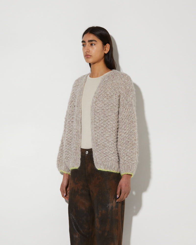 Model wearing Maiami alpaca bomber cardigan with pearl pattern in soft melange.