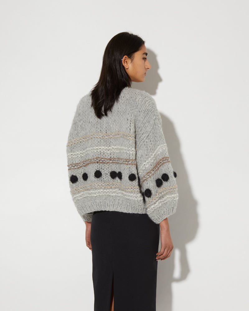 Back view of Maiami alpaca cardigan in grey with black bobbles.
