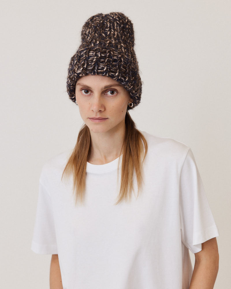 Model wearing hand-knitted beanie