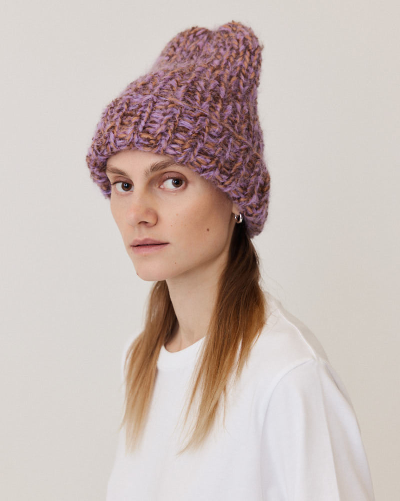 Model wearing hand-knitted beanie