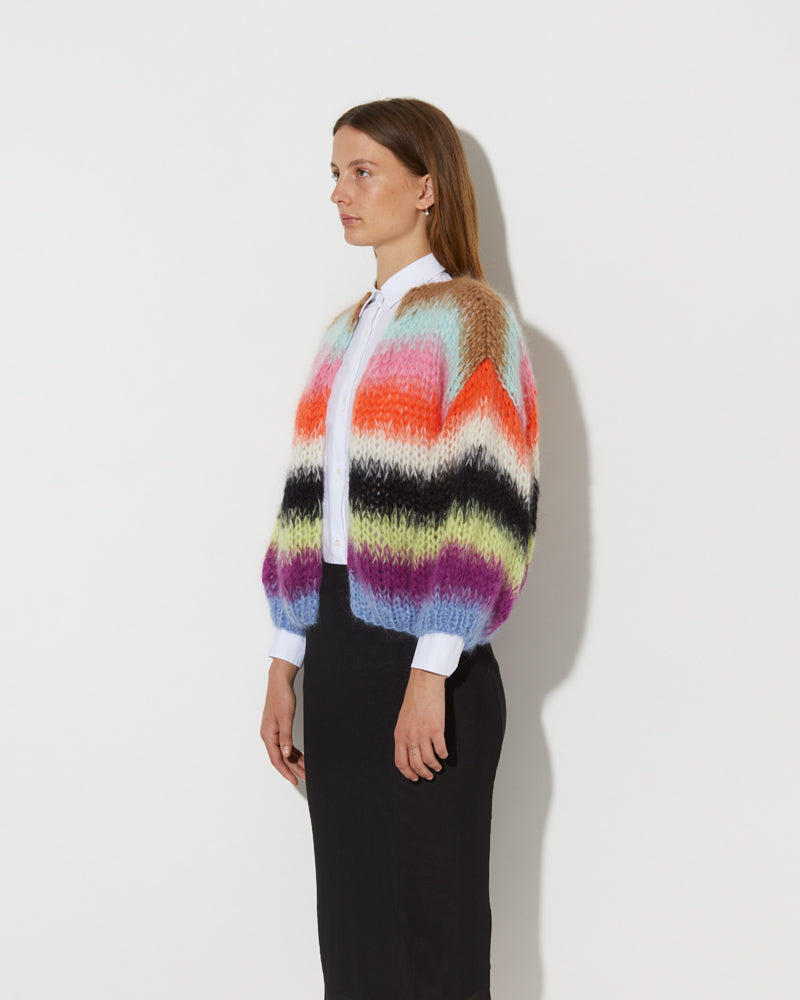 View from the side of model wearing the Mohair Bomber Cardigan with gradient stripes in the color 'Multicolour GS'