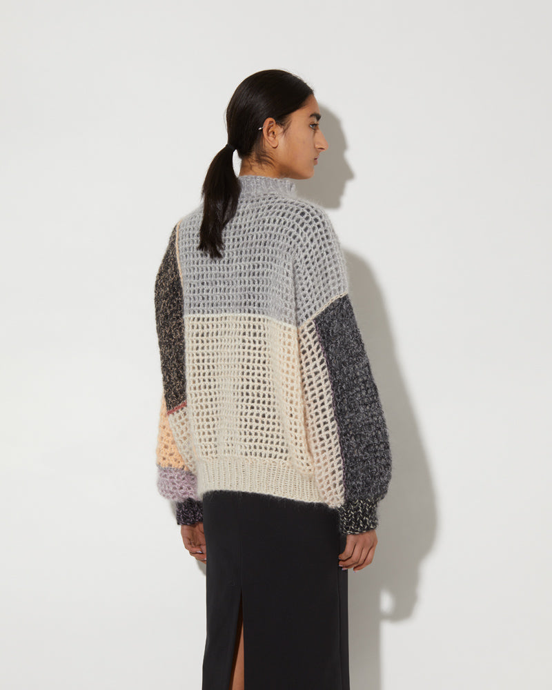 Back view of Maiami patchwork sweater.