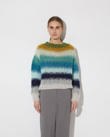 Frontal view of model wearing the new in Gradient Fade Pullover in the color 'Soft Fall'