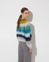 View from the back of model wearing the Gradient Fade Pullover in the color 'Soft Fall'