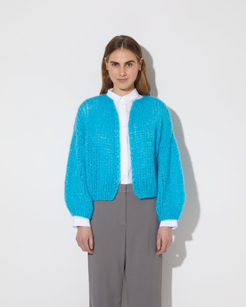 Frontal view of model wearing the new in Mohair Big Bomber Cardigan in the new color 'Cyan 2445'