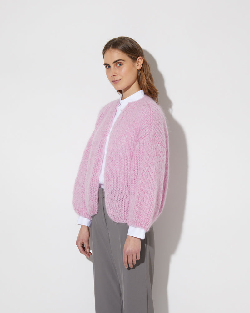 View from the side of model wearing the new in Mohair Big Bomber Cardigan in the new color 'Rose 28'