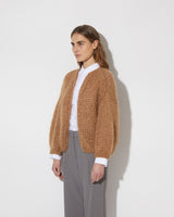 View from the side of model wearing the new in Mohair Big Bomber Cardigan in the new color 'Sahara 8014'