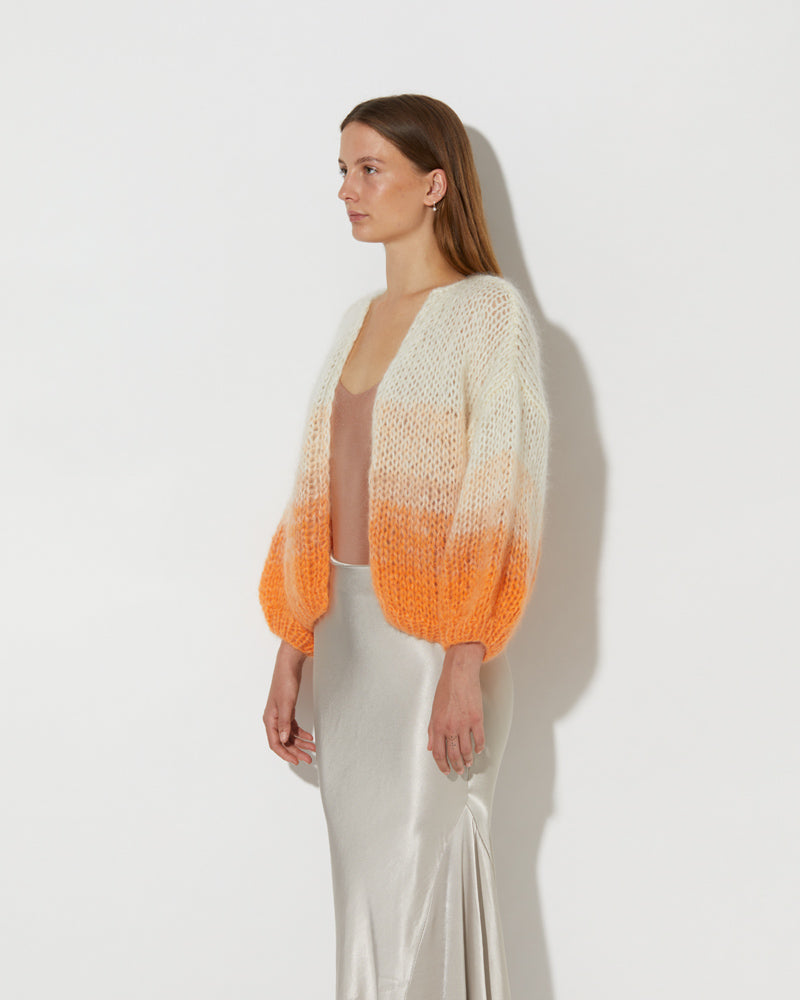Side view of Model wearing the Mohair Bomber Cardigan Ombre. Mohair cardigan sweater.