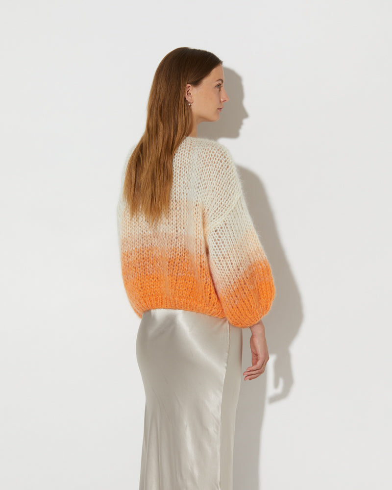 Side view of Model wearing the Mohair Bomber Cardigan Ombre. Mohair cardigan sweater.