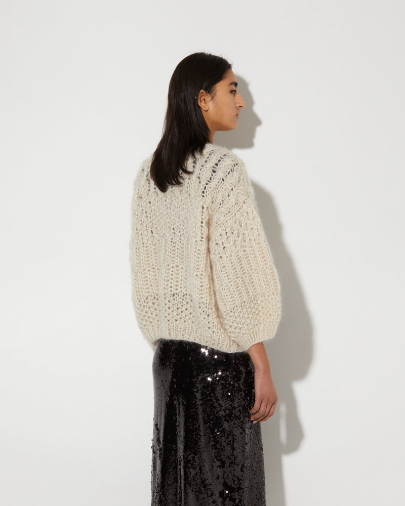 Back view of knitted Maiami cardigan in beige. Made from Mohair.
