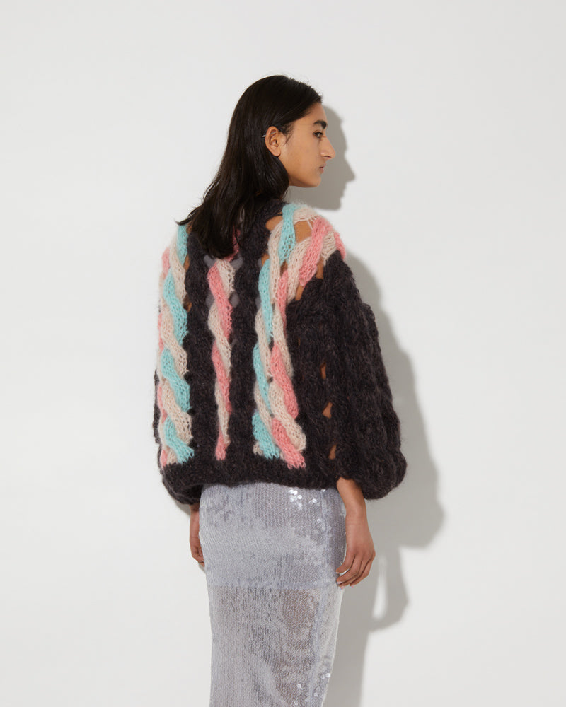 Back view of knitted Maiami bomber cardigan with cable pattern. Made from Mohair