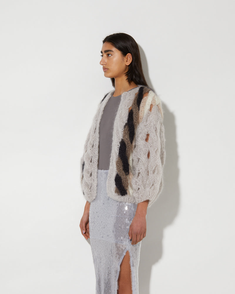 Side view of Maiami Cable Bomber Cardigan. Made from Mohair and coloured in pearl.