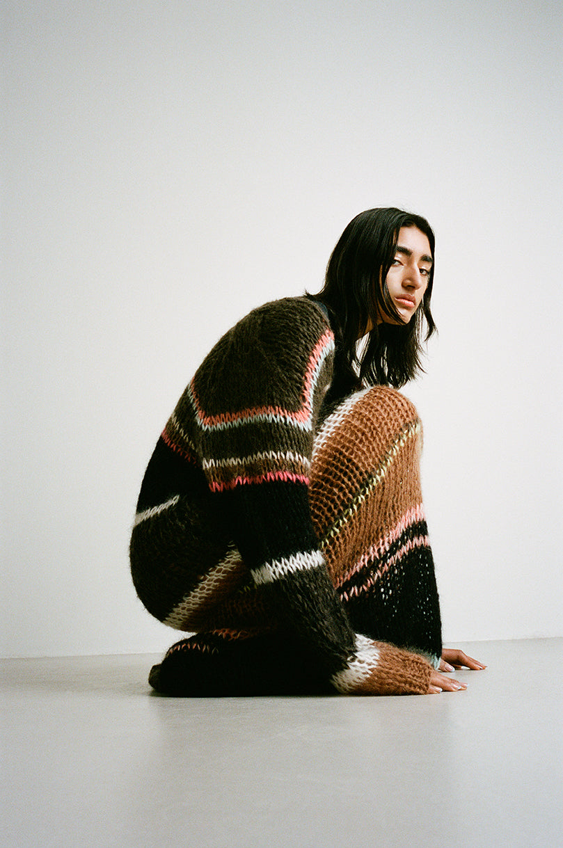 Model wearing Maiami knitted long dress in chocolate.