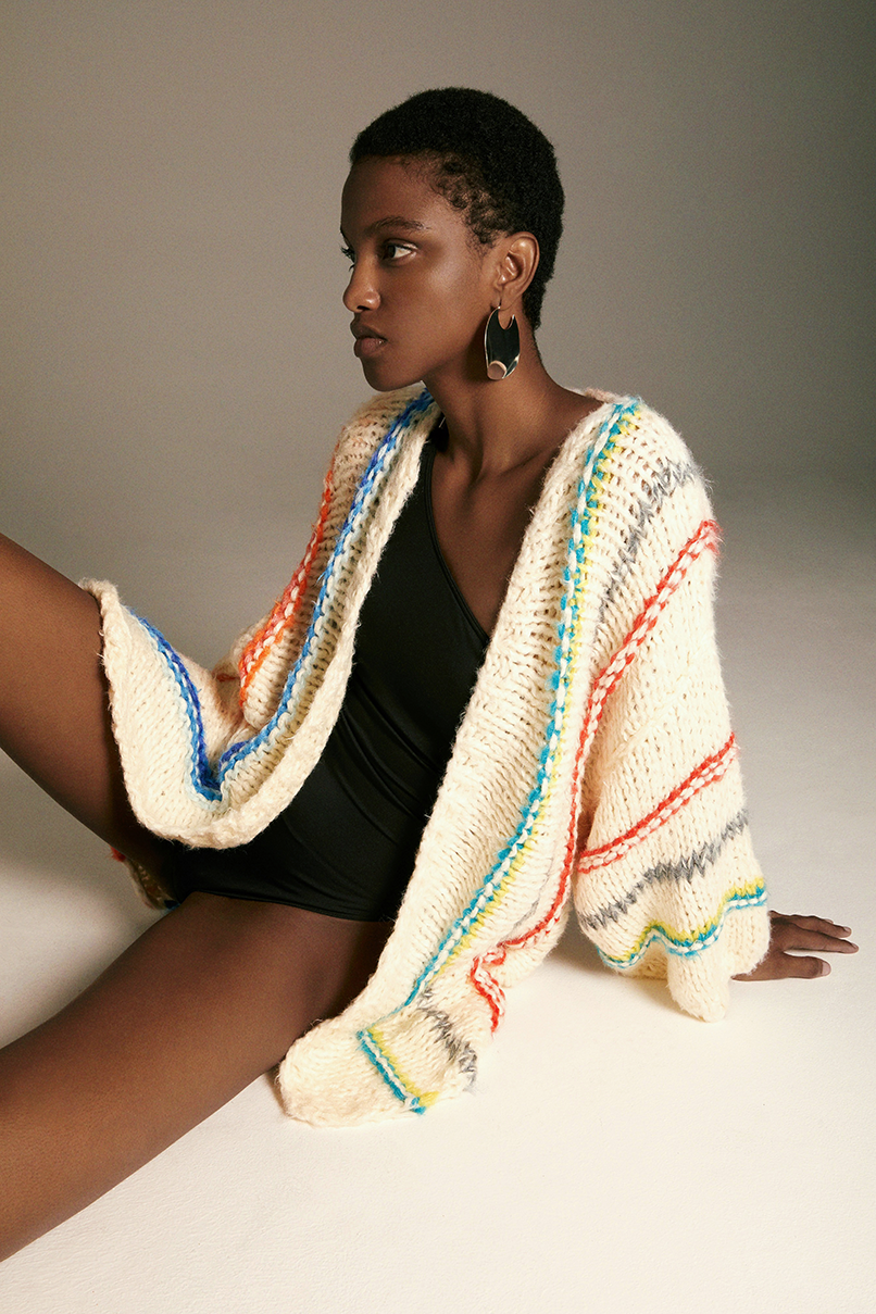Side shot of Model wearing the Silk Vertical Stripes Cardigan. Striped mohair cardigan.