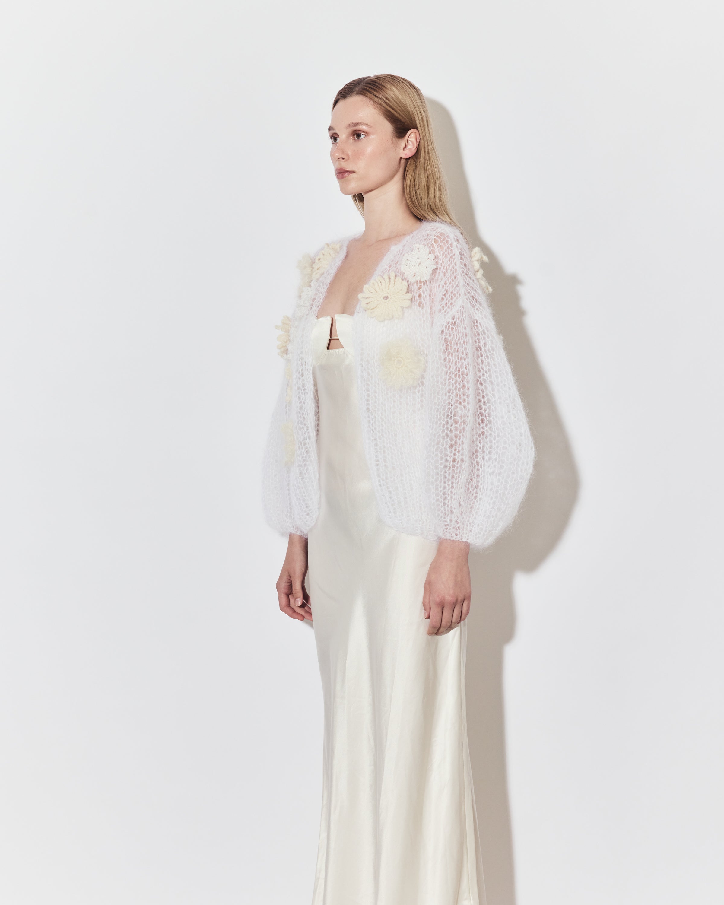 Maiami bridal knitwear layered over a minimalist wedding dress