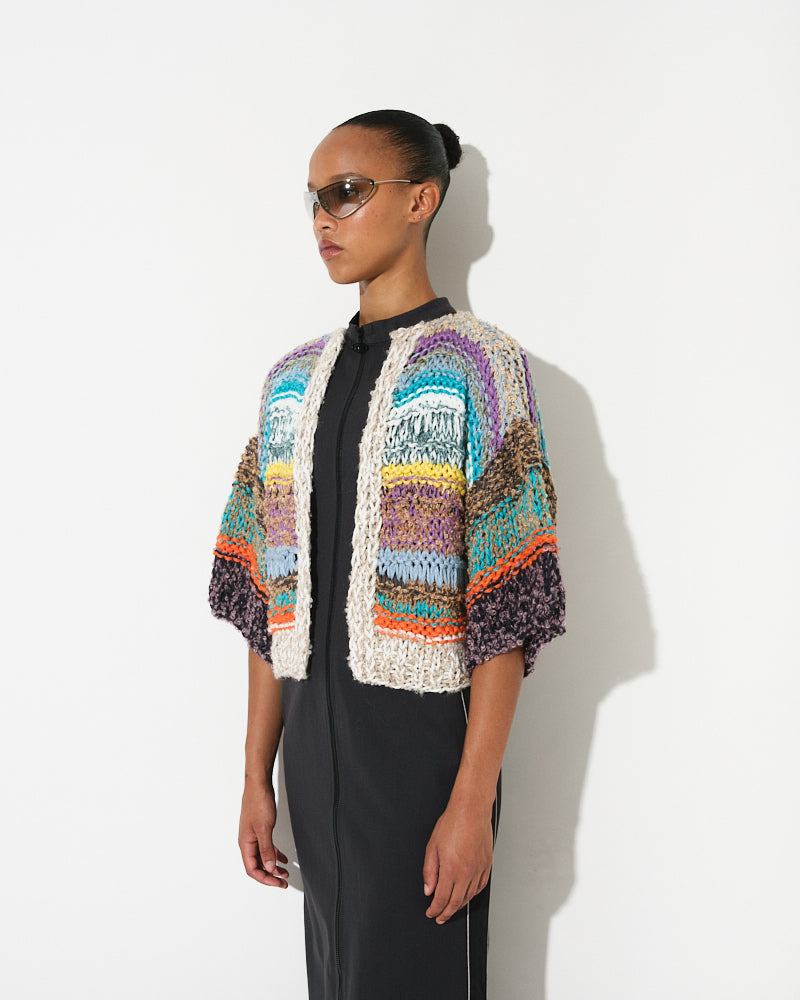 Model wearing short sleeve melange bouclé bomber cardigan, by Maiami, Spring 2025