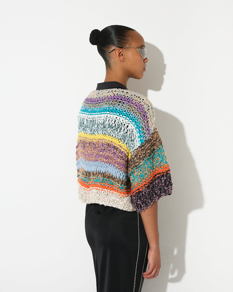Model wearing short sleeve melange bouclé bomber cardigan, by Maiami, Spring 2025