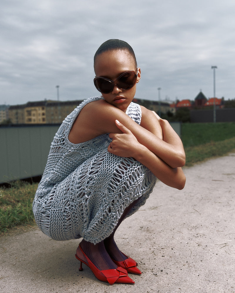 Model wearing sleeveless dropstitch cotton dress by Maiami, Spring 2025