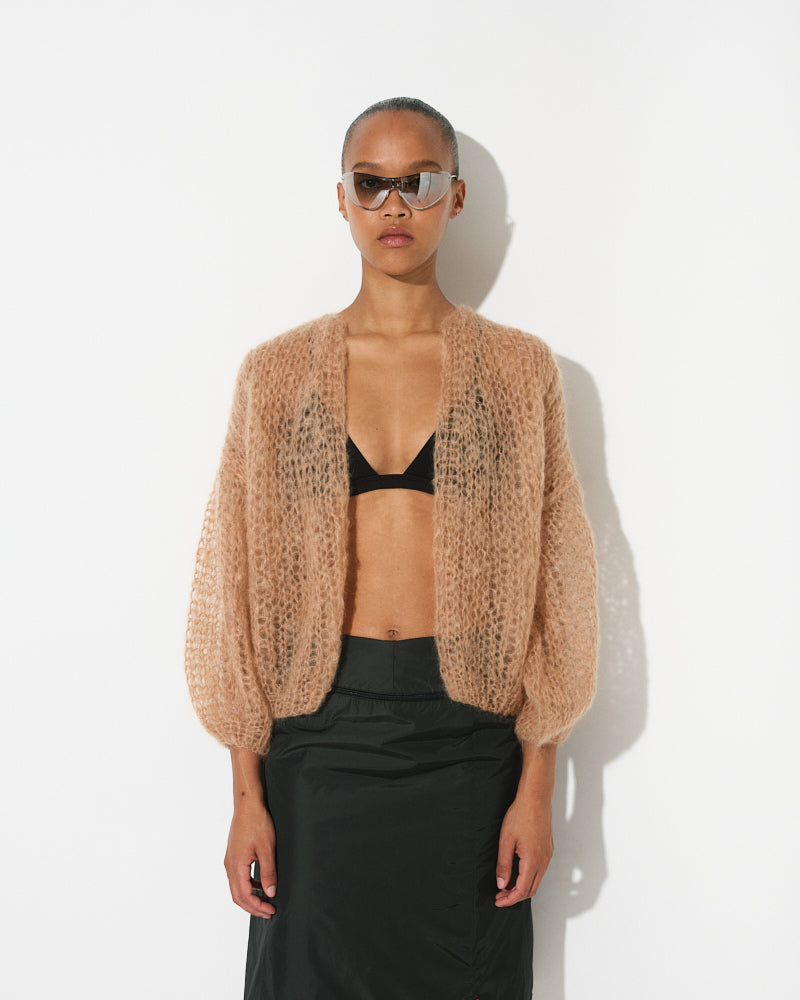 Model wearing light mohair bomber cardigan with spring stripes by Maiami, Spring 2025
